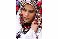 Kamen Zagorov. A Bulgarian girl in traditional spring robes. Silistra